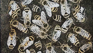 two color block print (black and yellow ink on white paper) of honeybees working a top of a black wood grain surface